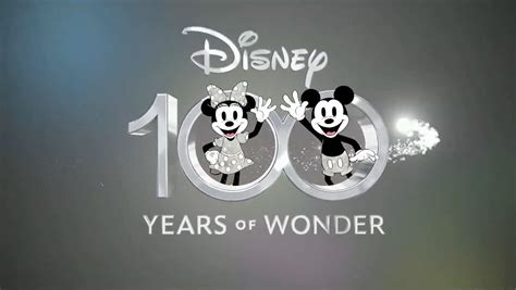 Screen art of Mickey and Minnie in celebration attire with <strong>Disney 100</strong> background. . Disney 100 years of wonder